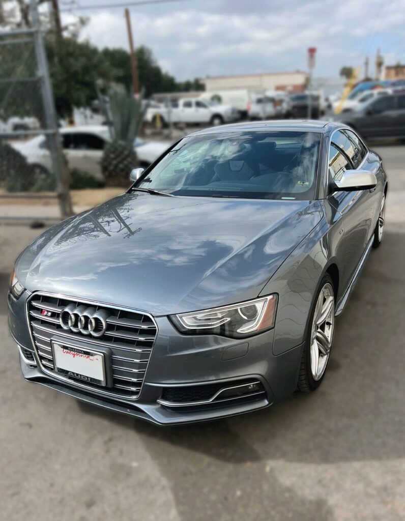 Front view of a metallic gray Audi A3 with glossy reflections after professional ceramic coating in Los Angeles